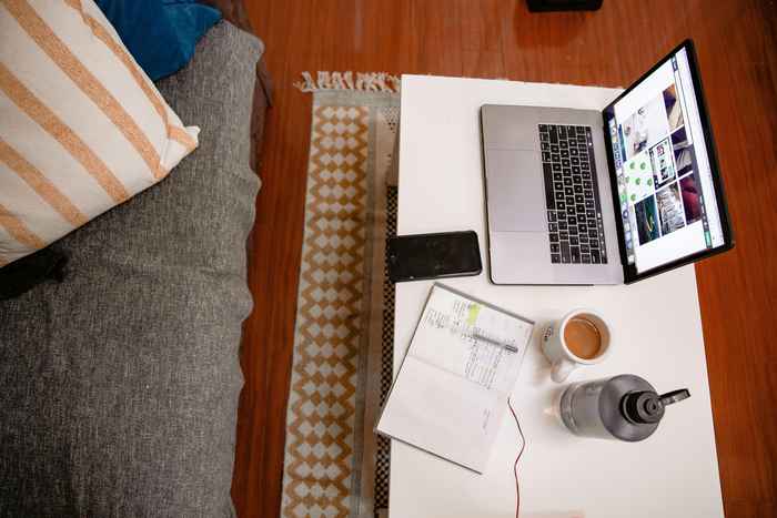 AI Prompt Evaluator Jobs for Beginners taking notes while working online