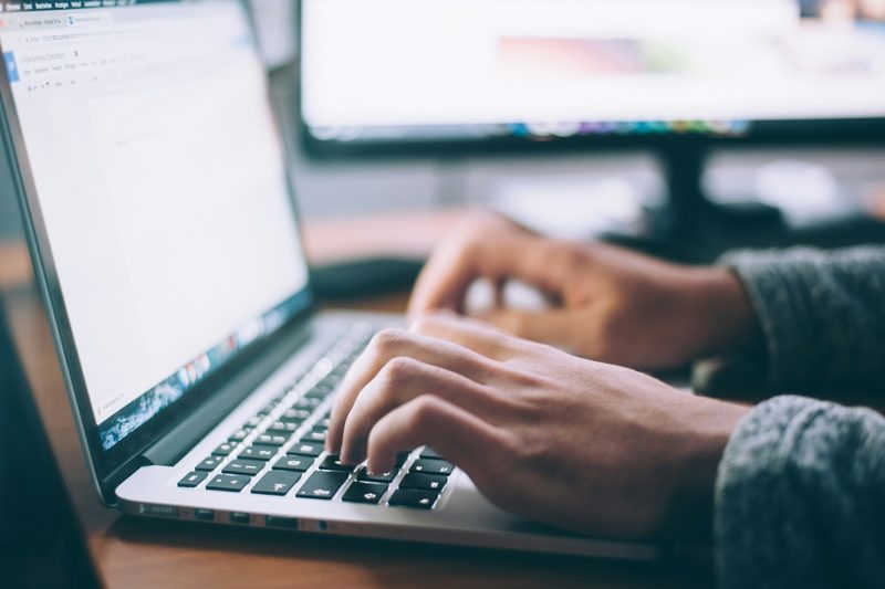 Beginner doing online data entry work on a laptop