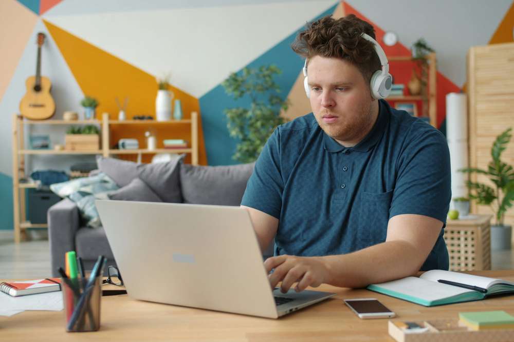 Online chat support agent remote hourly job with laptop